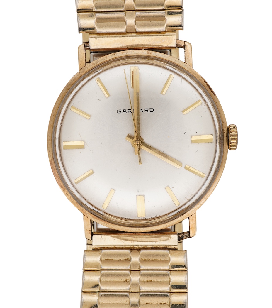 A gentleman's 1970's gold manual wind wrist watch, retailed by Garrard